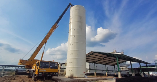 The field erection and integration phase of the FRP Scrubber tower and its anchoring system.